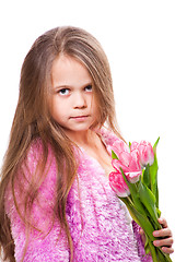 Image showing beautiful  little girl with bouquet of pink tulips isolated on white