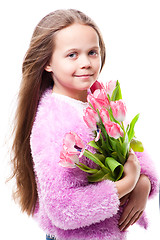 Image showing beautiful  little girl with bouquet of pink tulips isolated on white