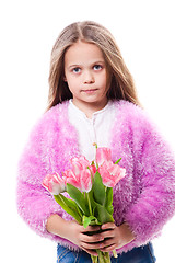 Image showing beautiful  little girl with bouquet of pink tulips isolated on white