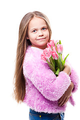 Image showing beautiful  little girl with bouquet of pink tulips isolated on white