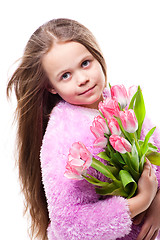 Image showing beautiful  little girl with bouquet of pink tulips isolated on white