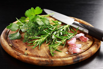 Image showing Herbs on wooden platter