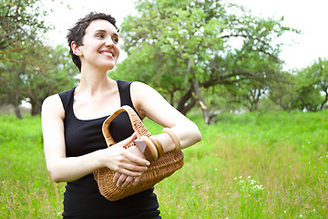 Image showing woman with basket in the garden 