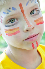 Image showing child with paintings on his face