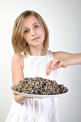 Image showing childl with traditional European Christmas food kutia