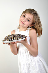 Image showing Young girl with traditional European Christmas food kutia