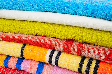 Image showing Colorful towels isolated on white background