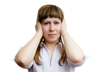 Image showing young girl covers his ears with his hands