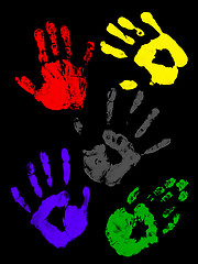 Image showing Colorful handprints on a black background