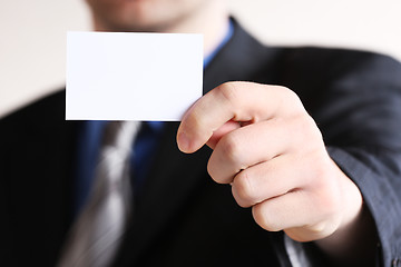 Image showing Young businessman offering businesscard 