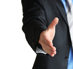 Image showing A business man with an open hand in a welcome gesture