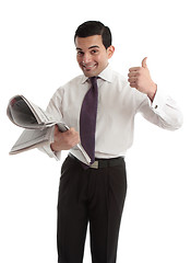 Image showing Businessman stockbroker with newspaper thumbs up
