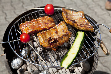 Image showing barbecue grill wiht meat outside in summer