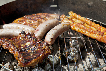 Image showing barbecue grill wiht meat outside in summer