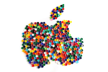 Image showing apple from the color plastic caps