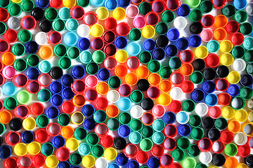 Image showing color plastic caps background