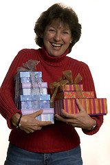 Image showing happy woman with gifts stack