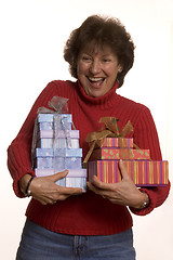 Image showing happy woman with gifts stack