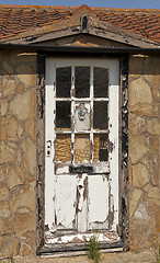Image showing Rotting wooden door