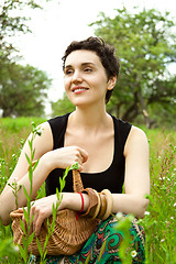 Image showing woman with basket in the garden 