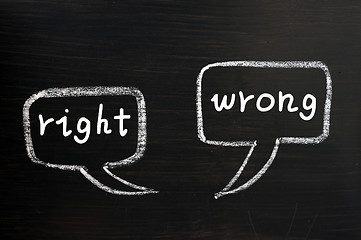 Image showing Two speech bubbles for right and wrong on a blackboard