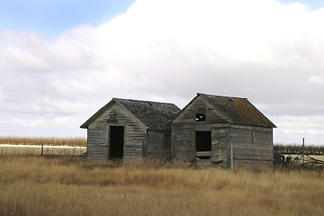 Image showing Two Old Grain Bins