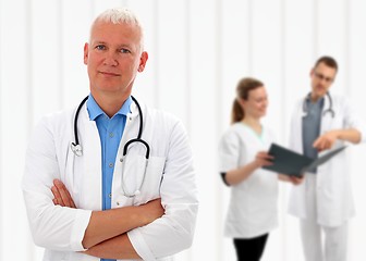 Image showing Senior doctor with his arms crossed