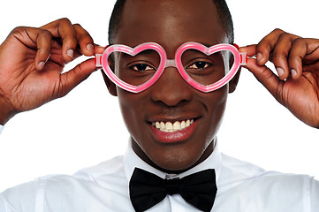 Image showing Smiling man wearing heart shaped eye-wear