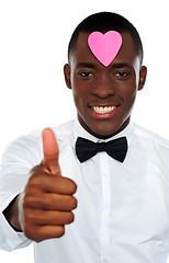 Image showing Love african boy gesturing thumbs-up
