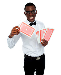 Image showing Young black boy ready to show his trump card