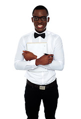 Image showing African guy holding spiral notebook