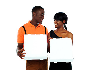 Image showing Loving couple holding pizza boxes