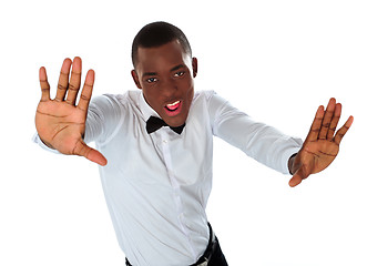 Image showing Happy stylish black man stretching to camera