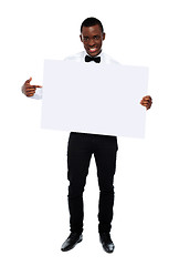 Image showing Guy indicating towards blank whiteboard