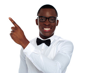 Image showing Welldressed young person pointing away