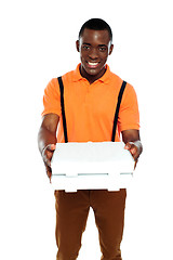 Image showing Pizza boy delivering an order