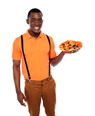 Image showing Handsome black man holding pizza