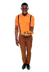 Image showing Full length portrait of delivery boy with pizza