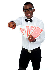 Image showing Gambler with playing cards pointing at you