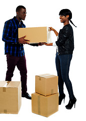 Image showing Couple moving empty cartons