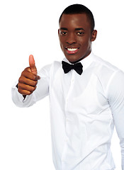 Image showing African boy in party-wear gesturing thumbs-up