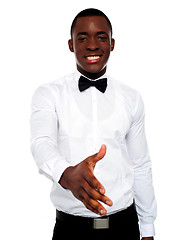 Image showing Attractive young man offering handshake