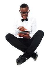 Image showing African boy watching video on tablet pc
