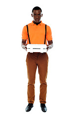 Image showing Full length portrait of delivery boy with pizza