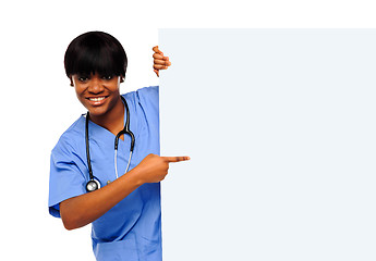 Image showing Medical expert pointing towards placard