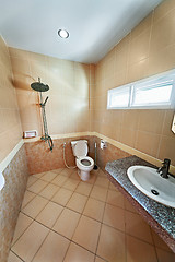 Image showing Iinterior of beige bathroom with shower