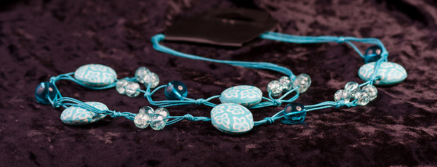 Image showing blue beads on a string