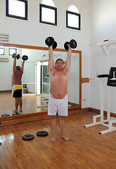 Image showing fun man with dumbbells