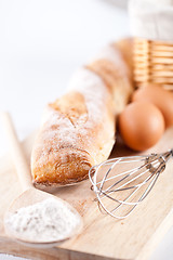 Image showing bread, flour, eggs and kitchen utensil