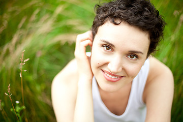 Image showing happy cute girl on green field 